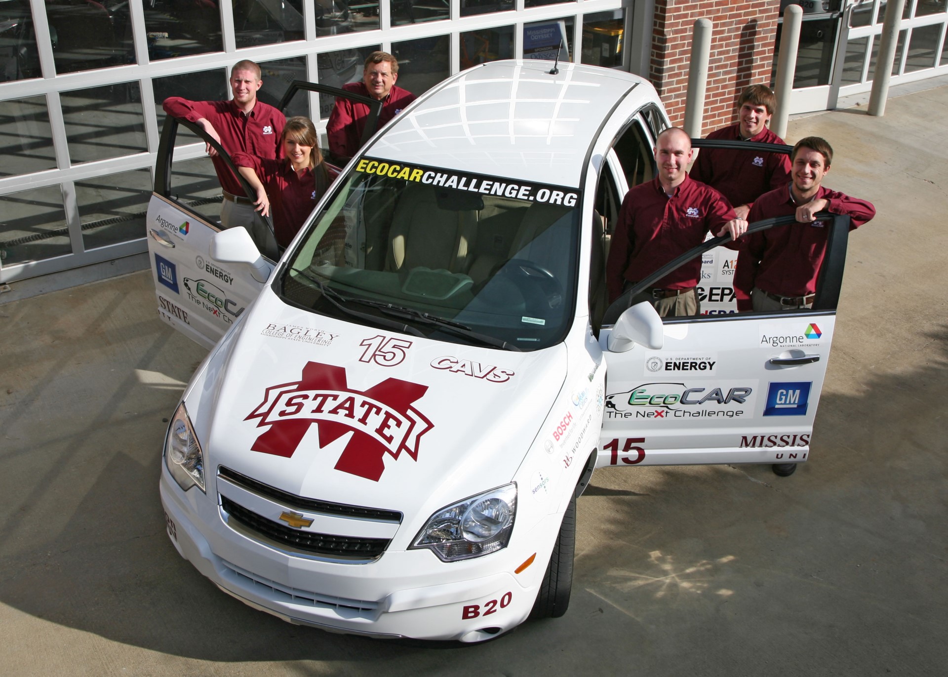 white chevy ecocar and team